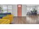 Bright living area featuring modern furnishings, wood floors, and an inviting front door at 351 Gnarly Oak Ln, Summerville, SC 29485