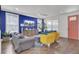 Comfortable living room featuring modern furniture, wood floors, and a decorative rug at 351 Gnarly Oak Ln, Summerville, SC 29485