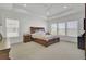 Large main bedroom with carpet, neutral walls and a tray ceiling at 351 Gnarly Oak Ln, Summerville, SC 29485