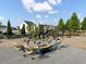 Community playground with swings, slides, and climbing structures; picnic tables and landscaping provide Gathering-friendly outdoor fun at 351 Gnarly Oak Ln, Summerville, SC 29485