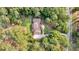 A beautiful home and verdant property are surrounded by lush trees and landscaping from a birds eye view at 3555 Colonel Vanderhorst Cir, Mount Pleasant, SC 29466