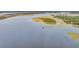 Scenic aerial view of a tranquil waterway with a long pier extending into the water at 3555 Colonel Vanderhorst Cir, Mount Pleasant, SC 29466