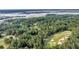 Scenic aerial view overlooking a golf course, lush greenery, and waterfront at 3555 Colonel Vanderhorst Cir, Mount Pleasant, SC 29466