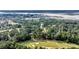 A sprawling neighborhood and golf course is surrounded by waterways and lush trees from a bird's eye view at 3555 Colonel Vanderhorst Cir, Mount Pleasant, SC 29466