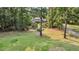 Backyard with mature trees offering shade to home and lawn, providing a private and peaceful setting at 3555 Colonel Vanderhorst Cir, Mount Pleasant, SC 29466