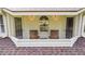 Cozy balcony features wooden chairs, shuttered windows, and a charming spot to relax and unwind at 3555 Colonel Vanderhorst Cir, Mount Pleasant, SC 29466