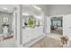 Bright bathroom with double vanity, marble floors, and a view to the living room at 3555 Colonel Vanderhorst Cir, Mount Pleasant, SC 29466