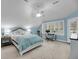 Bedroom with blue walls, white trim, carpet, ceiling fan, and windows offering ample natural light at 3555 Colonel Vanderhorst Cir, Mount Pleasant, SC 29466