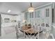 Bright dining area with large windows, ample light, and a view of the kitchen at 3555 Colonel Vanderhorst Cir, Mount Pleasant, SC 29466