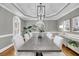 Bright dining room showcasing hardwood floors, stylish light fixtures, and ample seating at 3555 Colonel Vanderhorst Cir, Mount Pleasant, SC 29466