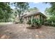 Stately brick home with a side-entry garage, lush landscaping, and a well-manicured lawn in a tranquil setting at 3555 Colonel Vanderhorst Cir, Mount Pleasant, SC 29466