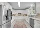 Well-lit kitchen featuring white cabinets, stainless steel appliances, granite countertops, and a cozy rug at 3555 Colonel Vanderhorst Cir, Mount Pleasant, SC 29466