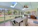 Relaxing screened porch with dining area, grill, ceiling fan, and backyard views at 3555 Colonel Vanderhorst Cir, Mount Pleasant, SC 29466