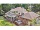 Back of home features a screened in porch, wood deck, and outdoor furniture at 3555 Colonel Vanderhorst Cir, Mount Pleasant, SC 29466
