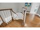 Elegant curved staircase with wooden steps and white balusters at 3555 Colonel Vanderhorst Cir, Mount Pleasant, SC 29466