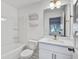 Bathroom features a new toilet, a tub, and decorative gold accessories at 4067 S Rhett Ave, North Charleston, SC 29405