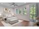 Cozy bedroom with a king-size bed and access to a balcony at 4067 S Rhett Ave, North Charleston, SC 29405