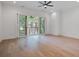 Spacious bedroom with a ceiling fan and sliding glass doors that let in abundant natural light at 4067 S Rhett Ave, North Charleston, SC 29405