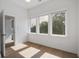 Sunny bedroom showcasing hardwood floors and lots of natural light at 4067 S Rhett Ave, North Charleston, SC 29405