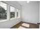 Light and airy bedroom featuring hardwood floors and many windows at 4067 S Rhett Ave, North Charleston, SC 29405