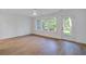 Spacious bedroom features hardwood floors, a ceiling fan and natural light with backyard views at 4067 S Rhett Ave, North Charleston, SC 29405