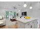 Open living area with a kitchen island, seamlessly blending living, dining, and kitchen spaces at 4067 S Rhett Ave, North Charleston, SC 29405