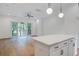 Bright living room with hardwood floors and sliding glass doors to the outdoors at 4067 S Rhett Ave, North Charleston, SC 29405