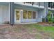 Cozy outdoor patio area with a door and multiple windows offering natural light at 4067 S Rhett Ave, North Charleston, SC 29405