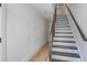 Staircase featuring wooden handrail and hardwood flooring at 4067 S Rhett Ave, North Charleston, SC 29405