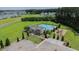 Aerial view of the amenity center with a swimming pool, lounge chairs, and a playground area at 470 Sanctuary Park Dr, Summerville, SC 29486
