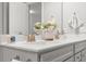 Bright bathroom featuring double sinks with modern faucets and white countertops at 470 Sanctuary Park Dr, Summerville, SC 29486