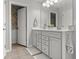 Bathroom featuring a double sink vanity, floral-themed water closet and neutral color scheme at 470 Sanctuary Park Dr, Summerville, SC 29486