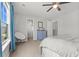 Bright bedroom with natural light and a blue accent dresser, offering a cozy and inviting atmosphere at 470 Sanctuary Park Dr, Summerville, SC 29486