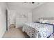 Neutral bedroom features a ceiling fan and patterned bedding at 470 Sanctuary Park Dr, Summerville, SC 29486