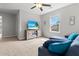 Bright bonus room with a plush sectional couch, modern tv stand, and plenty of natural light at 470 Sanctuary Park Dr, Summerville, SC 29486