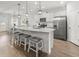 Modern kitchen with granite countertops, a central island, and stainless steel appliances at 470 Sanctuary Park Dr, Summerville, SC 29486