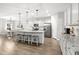 Bright, open-concept kitchen with a large island, granite countertops, and stainless steel appliances at 470 Sanctuary Park Dr, Summerville, SC 29486