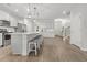 Bright and open kitchen with a large island, stainless steel appliances, and ample cabinet space at 470 Sanctuary Park Dr, Summerville, SC 29486