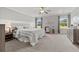 Spacious main bedroom with lots of natural light, ceiling fan, and plush carpet at 470 Sanctuary Park Dr, Summerville, SC 29486