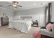 Neutral main bedroom features a ceiling fan, board and batten accent wall at 470 Sanctuary Park Dr, Summerville, SC 29486