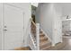 Staircase with carpeted steps and an ornate iron railing at 470 Sanctuary Park Dr, Summerville, SC 29486