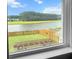 View of backyard with green grass, lake and treeline at 470 Sanctuary Park Dr, Summerville, SC 29486