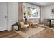Cozy seating area in living room with natural lighting from a large window at 5259 Hartford Cir, North Charleston, SC 29405