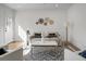 Bright living room featuring a modern sofa, decorative wall art, and stylish marble coffee table atop a geometric rug at 5259 Hartford Cir, North Charleston, SC 29405