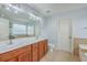 Bright bathroom boasts double sink vanity, tile floors, toilet, and view of the soaking tub and shower at 531 Crossland Dr, Moncks Corner, SC 29461