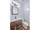 Modern bathroom with white countertop vanity, rustic wood drawers, and black faucet at 531 Crossland Dr, Moncks Corner, SC 29461