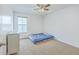 Bedroom with neutral carpet, ceiling fan, and a window overlooking the neighborhood at 531 Crossland Dr, Moncks Corner, SC 29461