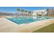 Community pool showcasing a modern design with palm trees, lounge chairs and an adjacent pergola at 531 Crossland Dr, Moncks Corner, SC 29461