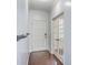 Bright entryway with hardwood floors, white doors, and modern coat rack at 531 Crossland Dr, Moncks Corner, SC 29461