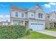 Beautiful two-story home featuring a two-car garage and a lush green lawn at 531 Crossland Dr, Moncks Corner, SC 29461